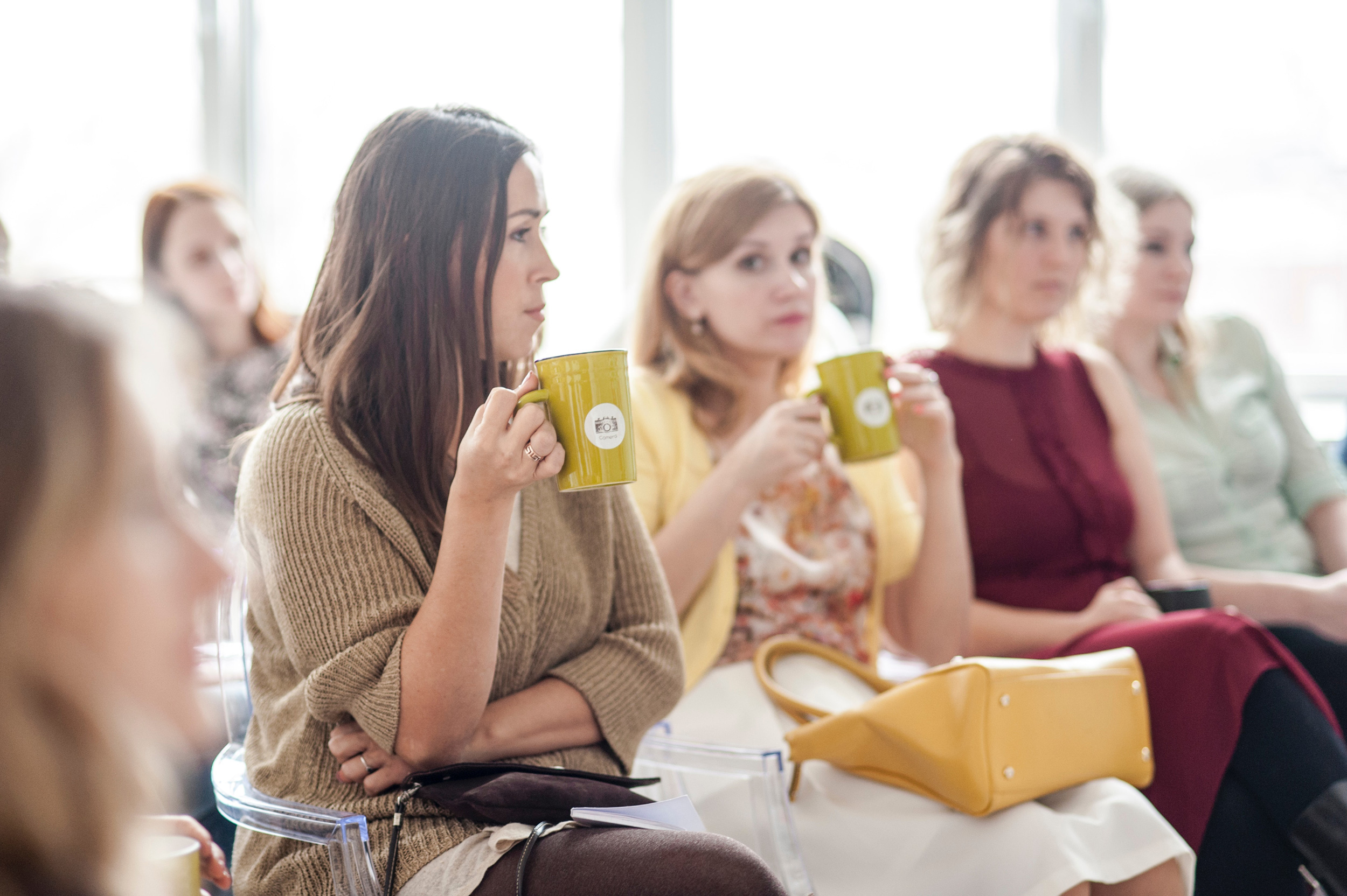 woman-wearing-brown-corduroy-coat-holding-mug-while-sitting-942418_web